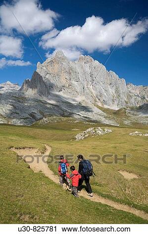 Stock Image - Family practice mountaineering in the? ndara massif, of walking in the Picos de Europa, the background, the top to the bottom Pea Vieja y Pea Olvidada Cantabria, Spain, Europe. Fotosearch