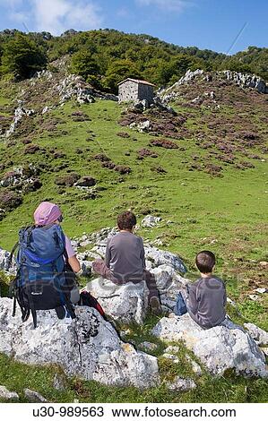 Stock Image - Family practice mountaineering in the? ndara massif, of walking next to the Picos de Europa National Park Oceo Asturias Spain. Fotosearch