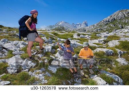 Stock Photo - Family practice mountaineering in the Urrieles massif, in the Picos de Europa National Park, Asturias, Spain. Fotosearch