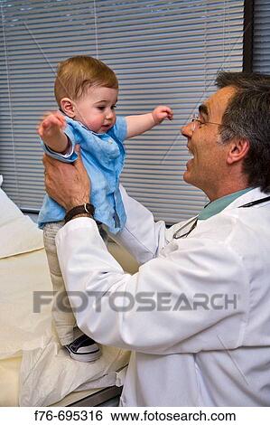 Family practice physician, doctor, pediatrician examining 8 month old child View Large Photo Image Stock Photograph - Family practice physician, doctor, pediatrician examining 8 month old child. Fotosearch