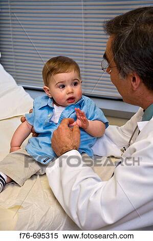 Family practice physician, doctor, pediatrician examining 8 month old child View Large Photo Image Stock Photography - Family practice physician, doctor, pediatrician examining 8 month old child. Fotosearch