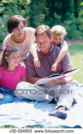 Family read together. View Large Photo Image Stock Image - Family read together.. Fotosearch
