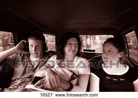 Stock Photo - Family riding in a taxi. Fotosearch