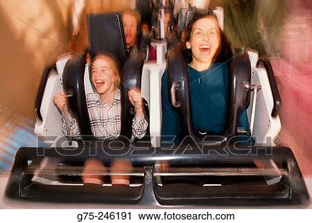 Family riding roller coaster View Large Photo Image Stock Image - Family riding roller coaster. Fotosearch