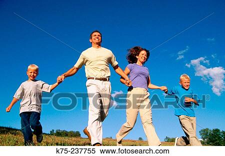 Stock Photography - Family running for fun. Fotosearch
