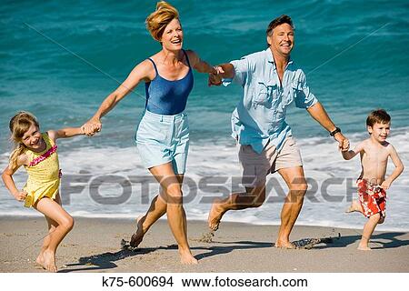 Family running on beach View Large Photo Image Picture - Family running on beach. Fotosearch