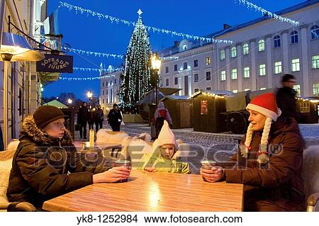 Family Sitting in Street Cafe Suudlevad Tundengid, Christmas, Winter, Tartu, Estonia View Large Photo Image Picture - Family Sitting in Street Cafe Suudlevad Tundengid, Christmas, Winter, Tartu, Estonia. Fotosearch