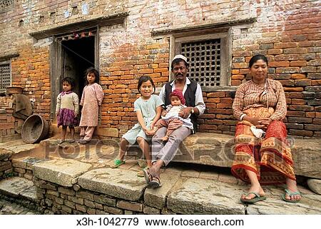 family sitting on his home? doorstep, Kokana village of Kathmandu valley, Lalitpur District, Nepal, Himalaya, South Asia View Large Photo Image Stock Photo - family sitting on his home? doorstep, Kokana village of Kathmandu valley, Lalitpur District, Nepal, Himalaya, South Asia. Fotosearch