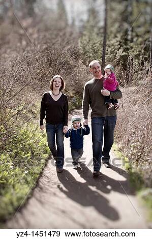 Family taking a walk in the woods View Large Photo Image Stock Photo - Family taking a walk in the woods. Fotosearch