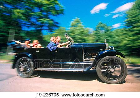 Family trip with a 30's Volvo car View Large Photo Image Stock Photography - Family trip with a 30's Volvo car. Fotosearch