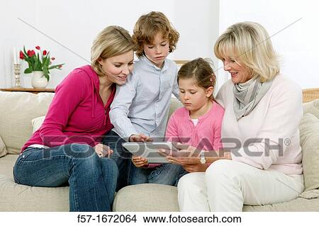 Family using tablet computer View Large Photo Image Picture - Family using tablet computer. Fotosearch