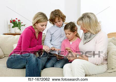 Family using tablet computer View Large Photo Image Stock Image - Family using tablet computer. Fotosearch