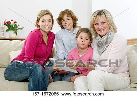 Family using tablet computer View Large Photo Image Stock Photograph - Family using tablet computer. Fotosearch