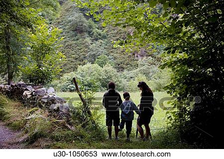 Family walking along the Dobra valley, in Picos De Europa Cangas de On's Asturias Spain View Large Photo Image Stock Image - Family walking along the Dobra valley, in Picos De Europa Cangas de On's Asturias Spain. Fotosearch
