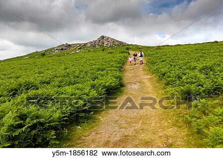 Family walking down from Bell Tor in the Dartmoor National Park, near Widecombe in the Moor, Devon, England, UK, Europe View Large Photo Image Stock Image - Family walking down from Bell Tor in the Dartmoor National Park, near Widecombe in the Moor, Devon, England, UK, Europe. Fotosearch