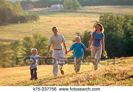 Stock Photograph - Family walking in country. Fotosearch