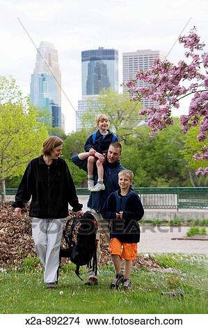 FAMILY WALKING IN MINNEAPOLIS PARK View Large Photo Image Picture - FAMILY WALKING IN MINNEAPOLIS PARK. Fotosearch