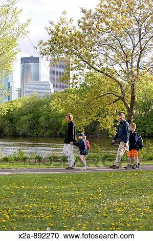 FAMILY WALKING IN MINNEAPOLIS PARK View Large Photo Image Stock Image - FAMILY WALKING IN MINNEAPOLIS PARK. Fotosearch