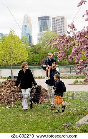 FAMILY WALKING IN MINNEAPOLIS PARK View Large Photo Image Stock Image - FAMILY WALKING IN MINNEAPOLIS PARK. Fotosearch