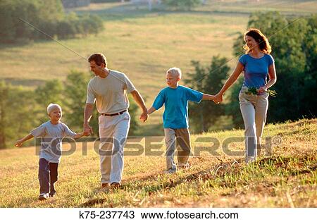 Family walking in the country View Large Photo Image Stock Image - Family walking in the country. Fotosearch