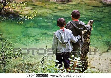 Family walking next to the Dobra river, in Picos De Europa Cangas de On's Asturias Spain View Large Photo Image Stock Photography - Family walking next to the Dobra river, in Picos De Europa Cangas de On's Asturias Spain. Fotosearch