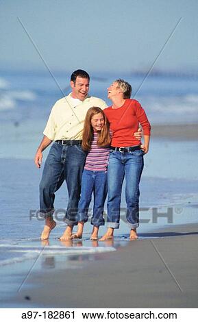 Family walking on beach View Large Photo Image Stock Image - Family walking on beach. Fotosearch