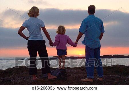 family watching beach sunset View Large Photo Image Stock Photography - family watching beach sunset. Fotosearch