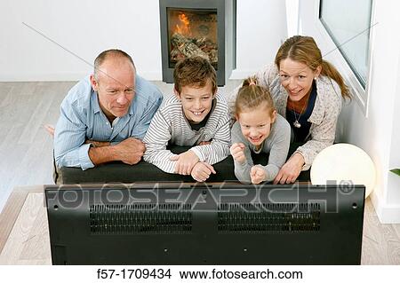 Family watching TV View Large Photo Image Picture - Family watching TV. Fotosearch