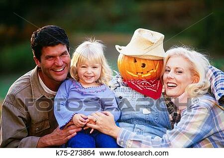 Family with a scarecrow View Large Photo Image Picture - Family with a scarecrow. Fotosearch