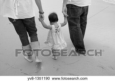 Family with baby girl walking at the beach, California View Large Photo Image Stock Image - Family with baby girl walking at the beach, California. Fotosearch