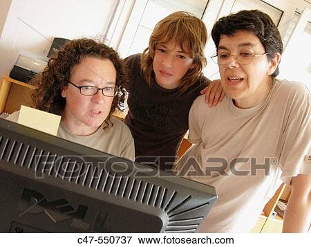 Family with desktop computer View Large Photo Image Stock Photo - Family with desktop computer. Fotosearch