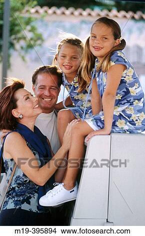 family with twins girls at an ATM machine View Large Photo Image Picture - family with twins girls at an ATM machine. Fotosearch