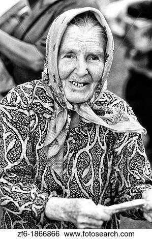 Stock Photograph - Famous Trans Siberian Railroad Older Woman Vendor in Krasnoyarsk Russia. Fotosearch