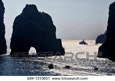 Faraglioni, name for three stacks located off the island of Capri. Capri, Italian island in the Tyrrhenian Sea off the Sorrentine Peninsula. South side of the Gulf of Naples. Campania region. Southern Italy. View Large Photo Image Stock Image - Faraglioni, name for three stacks located off the island of Capri. Capri, Italian island in the Tyrrhenian Sea off the Sorrentine Peninsula. South side of the Gulf of Naples. Campania region. Southern Italy.. Fotosearch