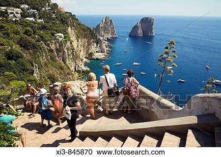 Faraglioni rocks, tourists and coastline, Capri, Italy View Large Photo Image Stock Image - Faraglioni rocks, tourists and coastline, Capri, Italy. Fotosearch