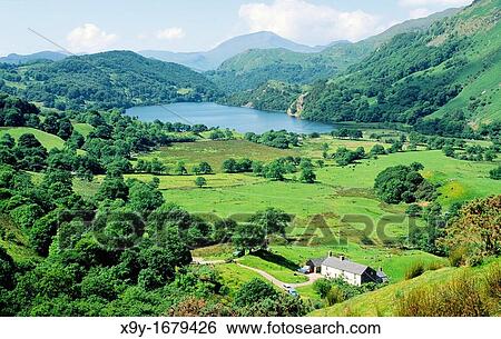 Farm farmhouse and Llyn Gwynant lake from Nant Cynnyd in Snowdonia National Park north Wales, UK View Large Photo Image Stock Photograph - Farm farmhouse and Llyn Gwynant lake from Nant Cynnyd in Snowdonia National Park north Wales, UK. Fotosearch