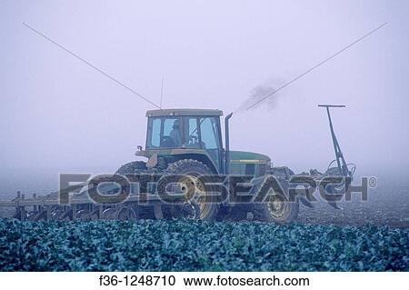 Farm plow tractor in fog shrouded field, near Guadalupe, Santa Maria Valley, San Luis Obispo County, CALIFORNIA View Large Photo Image Stock Image - Farm plow tractor in fog shrouded field, near Guadalupe, Santa Maria Valley, San Luis Obispo County, CALIFORNIA. Fotosearch