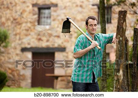 Farmer with hoe, hand tool,? caserio?, Guipuzcoa, Basque Country, Spain View Large Photo Image Stock Image - Farmer with hoe, hand tool,? caserio?, Guipuzcoa, Basque Country, Spain. Fotosearch