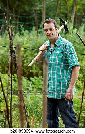 Farmer with hoe, hand tool, farming, kitchen garden, Guipuzcoa, Basque Country, Spain View Large Photo Image Picture - Farmer with hoe, hand tool, farming, kitchen garden, Guipuzcoa, Basque Country, Spain. Fotosearch