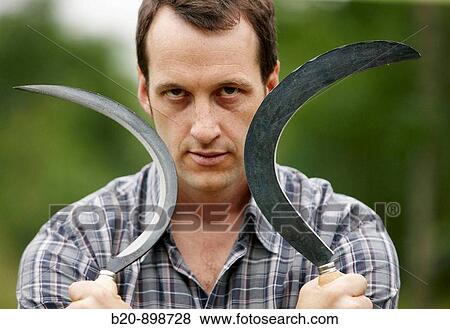 Stock Photo - Farmer with sickle. Fotosearch
