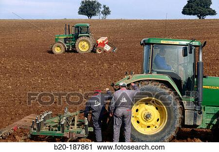 Stock Image - Farmers at field. Spain. Fotosearch