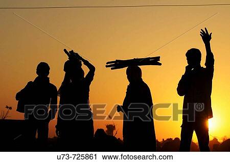 Farmers head back home after a very long day in the Naguar camel and cattle fair, Rajasthan, India View Large Photo Image Stock Image - Farmers head back home after a very long day in the Naguar camel and cattle fair, Rajasthan, India. Fotosearch
