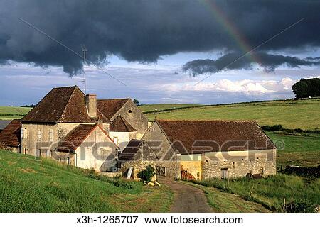 farmhouse under stormy sky, around Nevers, Nievre department, region of Burgundy, center of France, Europe View Large Photo Image Stock Photo - farmhouse under stormy sky, around Nevers, Nievre department, region of Burgundy, center of France, Europe. Fotosearch