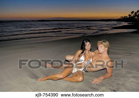 Fashion boys at sunset on the beach. View Large Photo Image Stock Image - Fashion boys at sunset on the beach.. Fotosearch