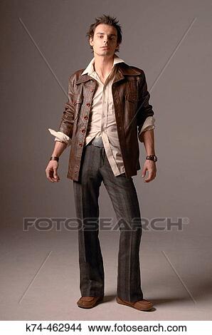 Picture - fashion image of young man in leather jacket. Fotosearch