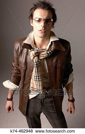 fashion image of young man in leather jacket and wearing sunglasses View Large Photo Image Stock Photo - fashion image of young man in leather jacket and wearing sunglasses. Fotosearch