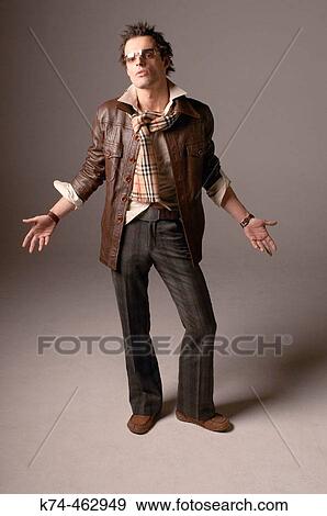 fashion image of young man in leather jacket and wearing sunglasses View Large Photo Image Stock Photo - fashion image of young man in leather jacket and wearing sunglasses. Fotosearch