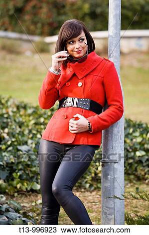 Fashionable young woman in Red in the park View Large Photo Image Stock Image - Fashionable young woman in Red in the park. Fotosearch