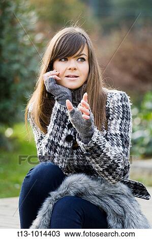 Fashionable young woman is talking View Large Photo Image Stock Image - Fashionable young woman is talking. Fotosearch