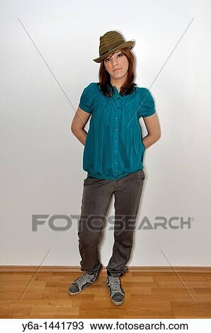 Fashionable young woman portrait wearing hat View Large Photo Image Stock Image - Fashionable young woman portrait wearing hat. Fotosearch